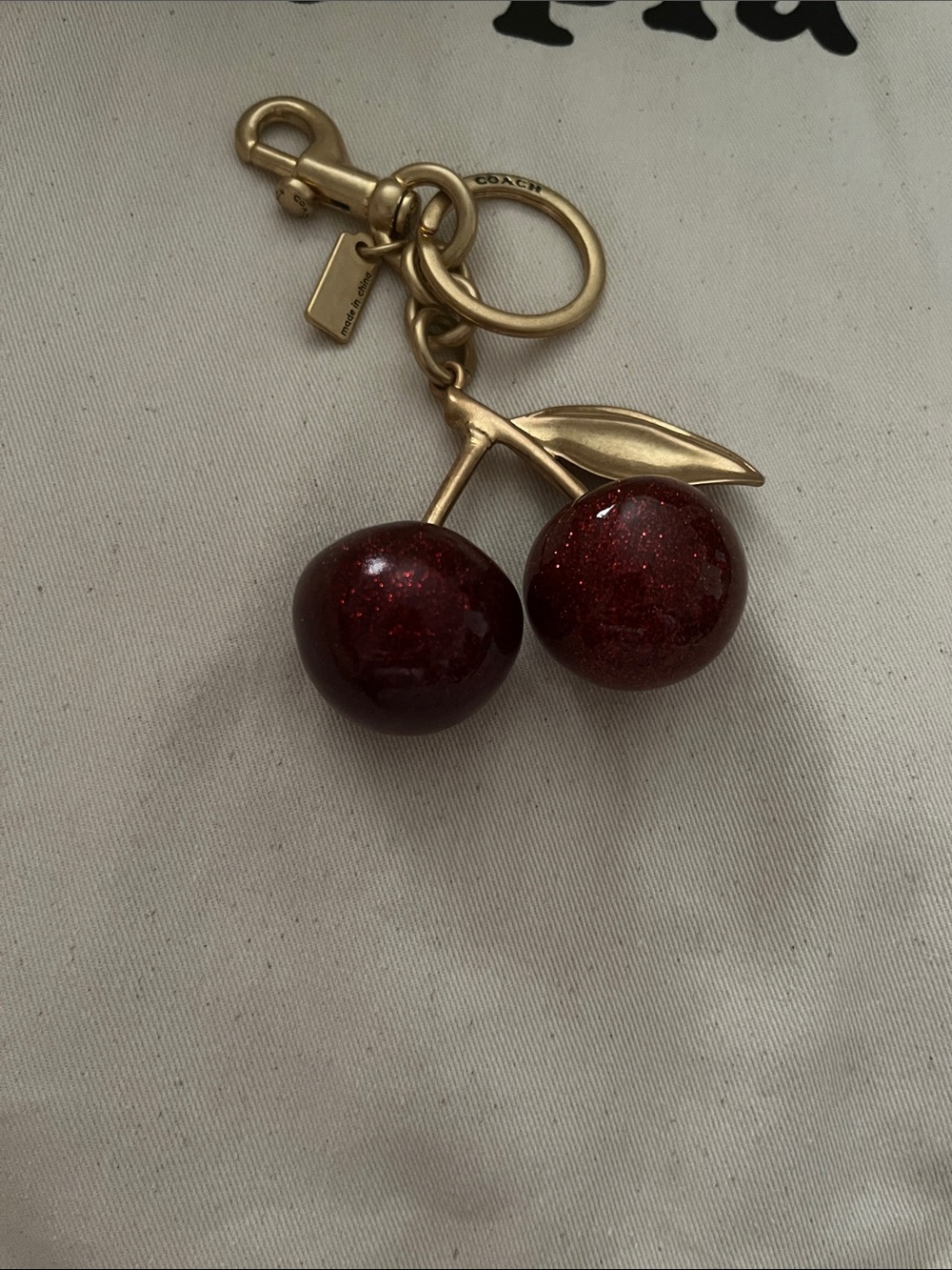 Coach Gold-Tone Cherry Key Charm with Glittery Deep Red Enamel